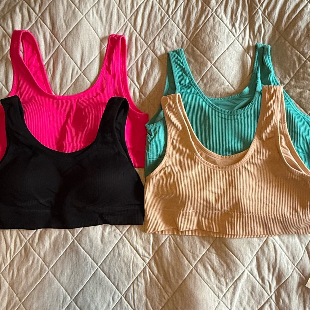 4! Barely worn 3x torrid bralettes. Soft molded cups. Pink, black, tan, teal